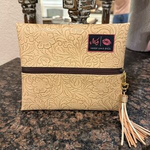 New Embossed Makeup Junkie bag
